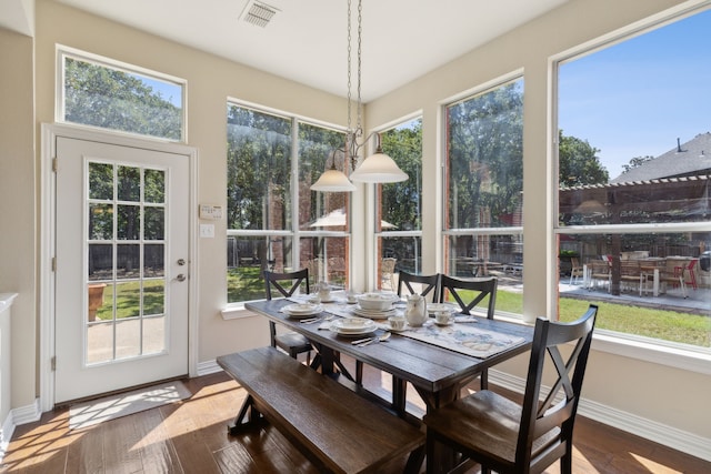 sunroom featuring visible vents