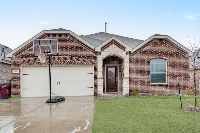 view of front of property with a front lawn, driveway, an attached garage, and brick siding