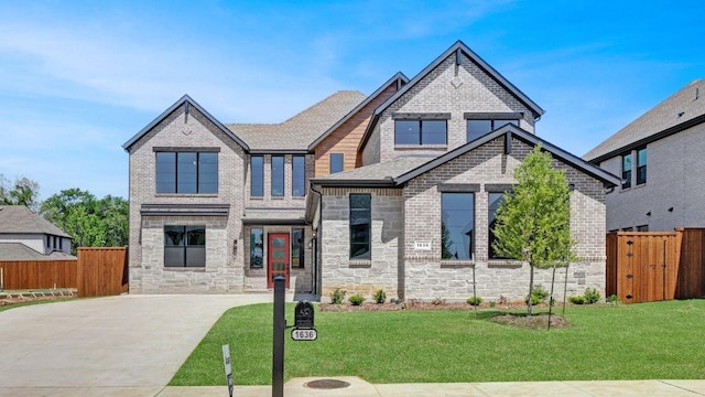 1636 Keneipp Rd, Carrollton, TX 75006 - craftsman-style house with brick siding, a front lawn, and fence