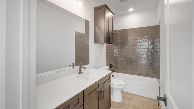 1636 Keneipp Rd, Carrollton, TX 75006 - full bathroom featuring recessed lighting, visible vents, toilet, vanity, and shower / bathing tub combination