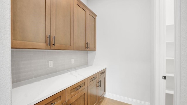 1636 Keneipp Rd, Carrollton, TX 75006 - interior space featuring decorative backsplash, baseboards, and light countertops