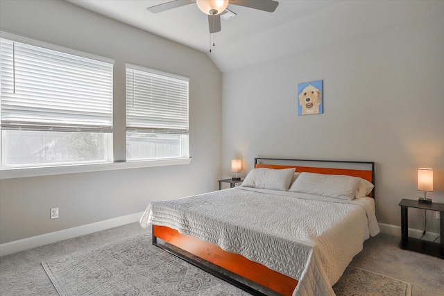 bedroom featuring carpet floors, baseboards, a ceiling fan, and lofted ceiling