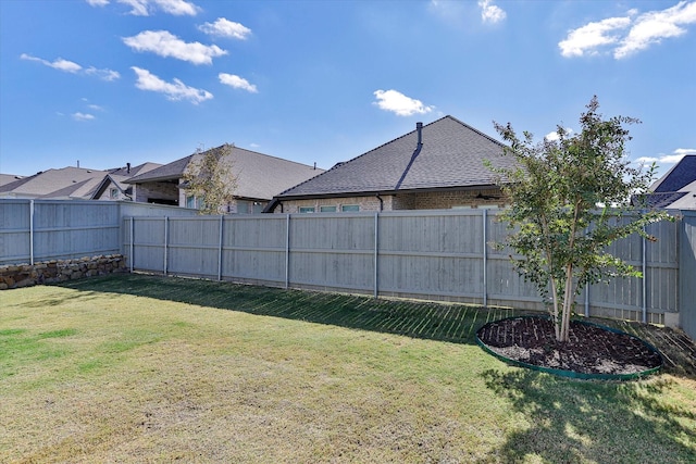 view of yard with a fenced backyard