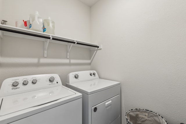 laundry area with laundry area and washer and clothes dryer