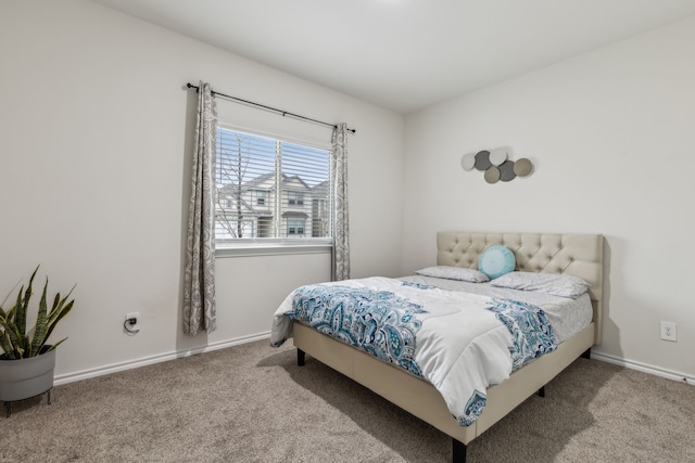 carpeted bedroom with baseboards