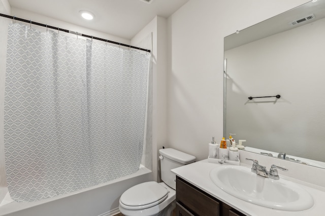 bathroom featuring toilet, shower / tub combo, vanity, and visible vents