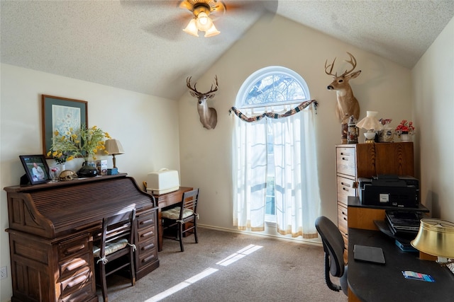 office with carpet floors, a ceiling fan, vaulted ceiling, a textured ceiling, and baseboards