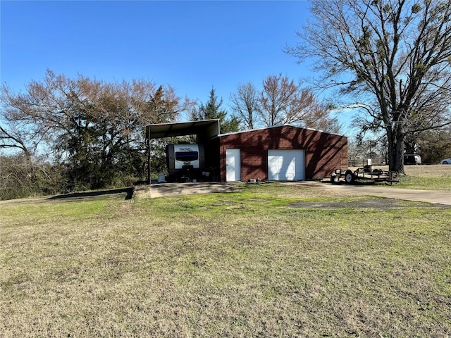 view of outdoor structure with driveway