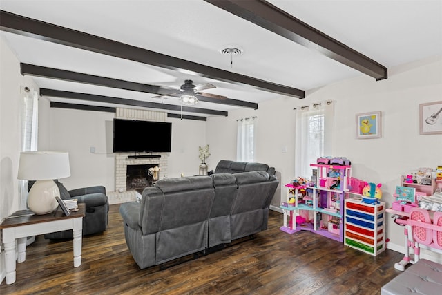 living room featuring a fireplace, visible vents, a ceiling fan, beam ceiling, and dark wood-style floors