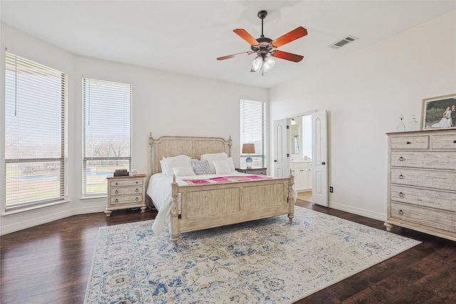 bedroom with dark wood-type flooring, visible vents, ceiling fan, and baseboards