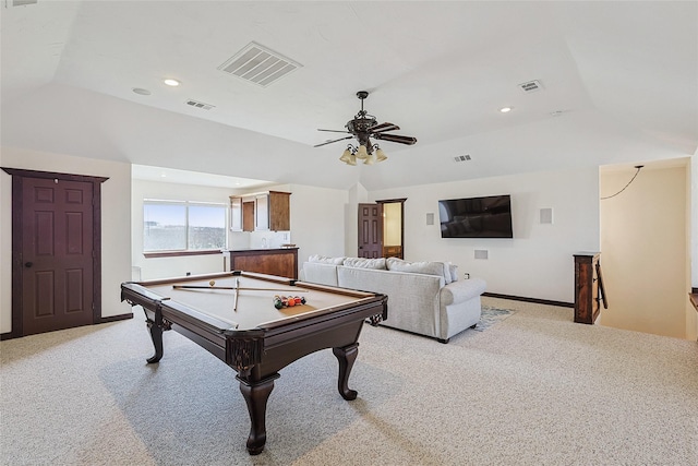 recreation room with lofted ceiling, light carpet, and visible vents