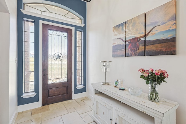 entryway featuring baseboards