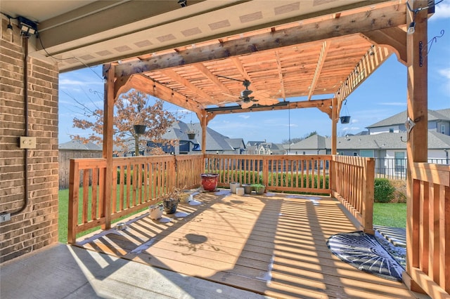 deck with ceiling fan, a residential view, fence, and a pergola