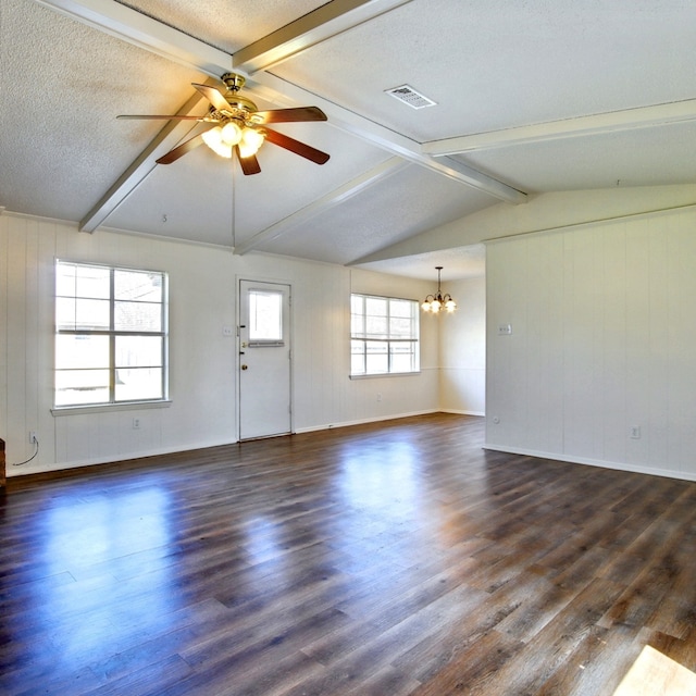 unfurnished room featuring lofted ceiling with beams, a textured ceiling, visible vents, and dark wood-type flooring