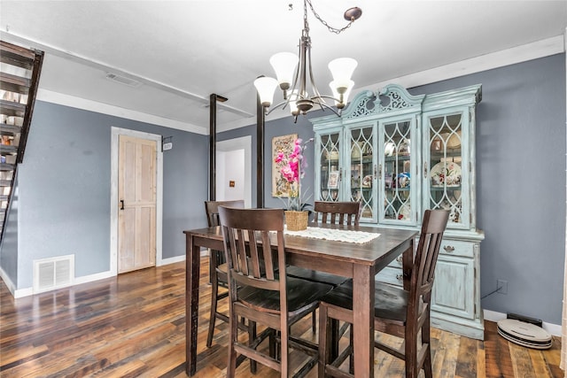 dining room with visible vents, baseboards, and dark wood-style flooring