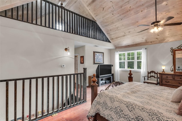 bedroom featuring high vaulted ceiling, wood ceiling, and wood finished floors