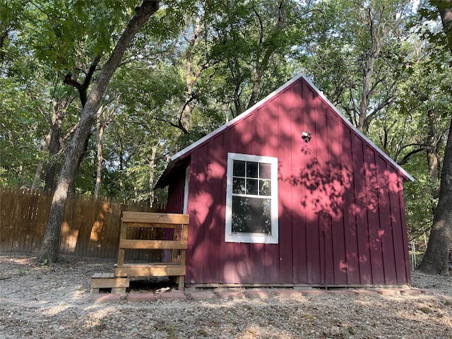 view of outdoor structure with an outdoor structure and fence