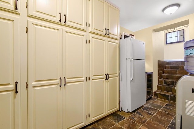 kitchen with freestanding refrigerator