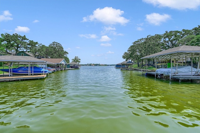 dock area with a water view and boat lift