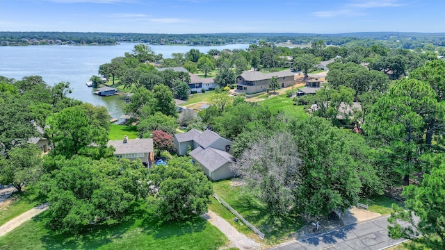 drone / aerial view with a water view and a residential view