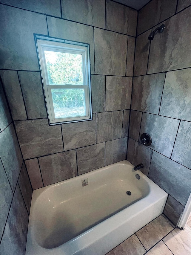 bathroom with shower / washtub combination