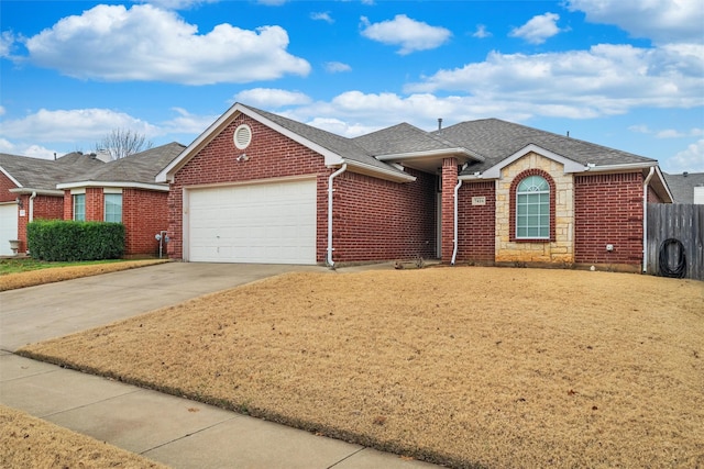 ranch-style house with brick siding, a shingled roof, concrete driveway, a garage, and stone siding