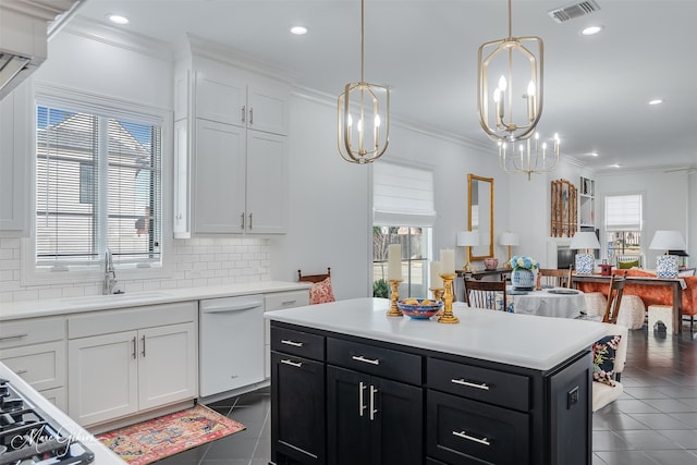 kitchen with light countertops, visible vents, open floor plan, white cabinets, and dishwasher