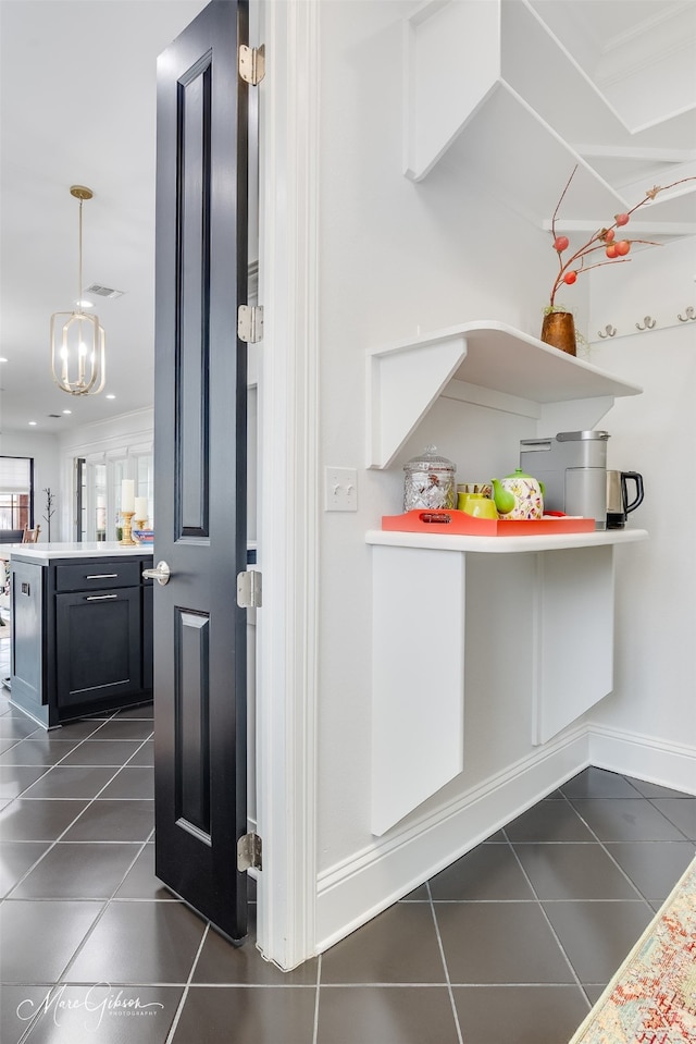 interior space featuring visible vents and baseboards