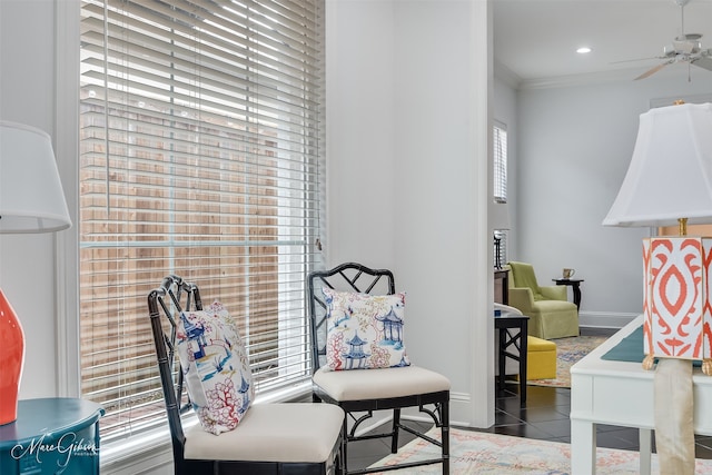 sitting room with crown molding, recessed lighting, ceiling fan, dark tile patterned floors, and baseboards