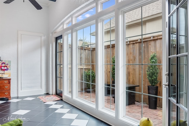 doorway to outside featuring ceiling fan