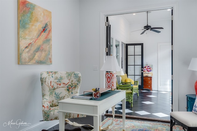interior space with ceiling fan