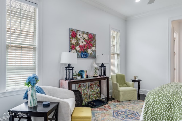 living area with a healthy amount of sunlight, baseboards, ornamental molding, and recessed lighting