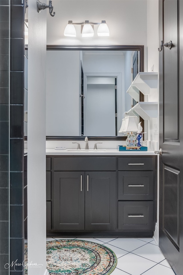 bathroom with tile patterned floors and vanity