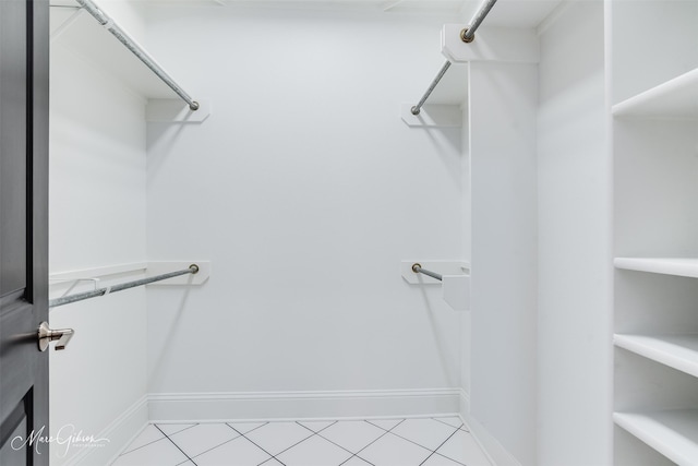 walk in closet featuring light tile patterned flooring