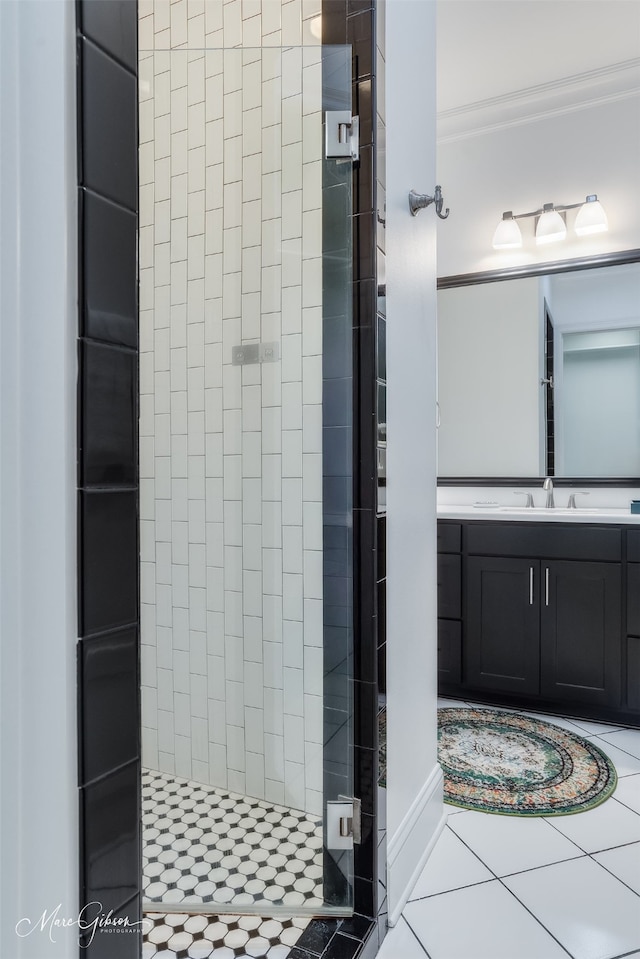 full bath with a stall shower, tile patterned flooring, and vanity