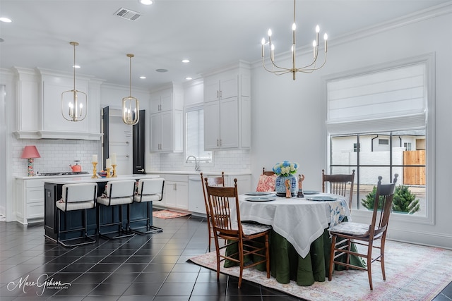 dining space with crown molding, recessed lighting, visible vents, an inviting chandelier, and dark tile patterned floors