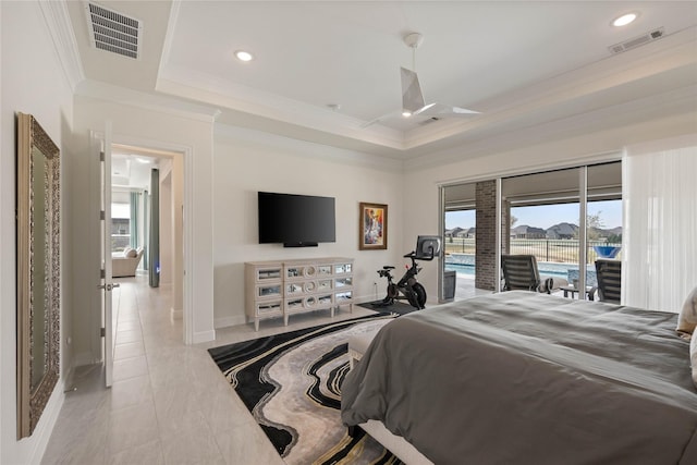 bedroom with crown molding, a tray ceiling, visible vents, and access to exterior