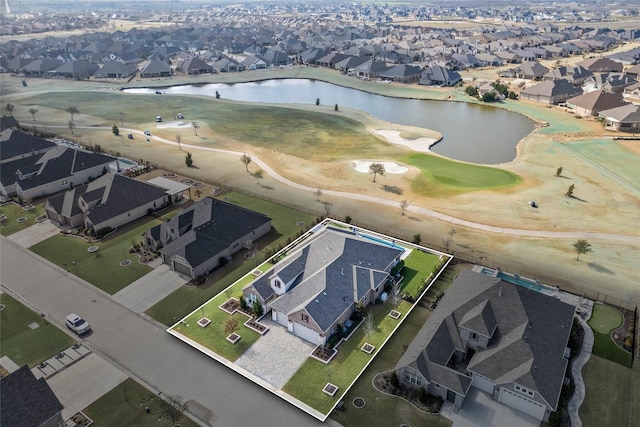 bird's eye view with golf course view, a water view, and a residential view