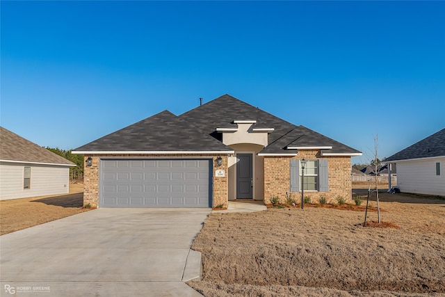 view of front facade with driveway, an attached garage, and brick siding