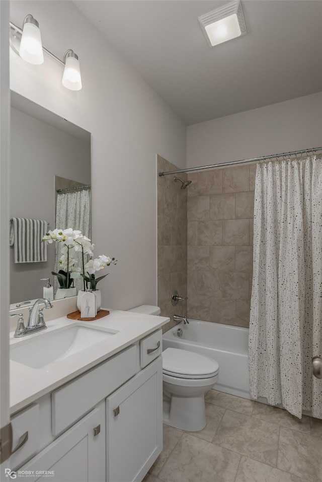 full bathroom featuring toilet, shower / bath combo, vanity, and visible vents