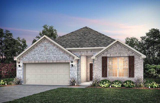 french provincial home featuring roof with shingles, brick siding, concrete driveway, an attached garage, and a front yard