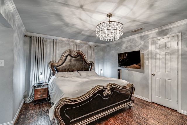 bedroom with an inviting chandelier, baseboards, visible vents, and ornamental molding