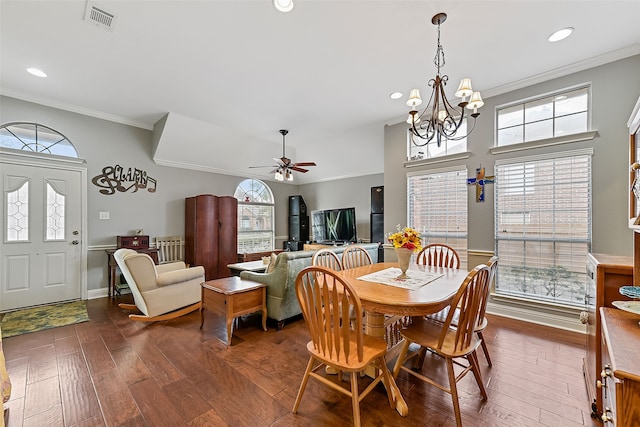 dining space featuring ceiling fan with notable chandelier, dark wood-style flooring, visible vents, and crown molding