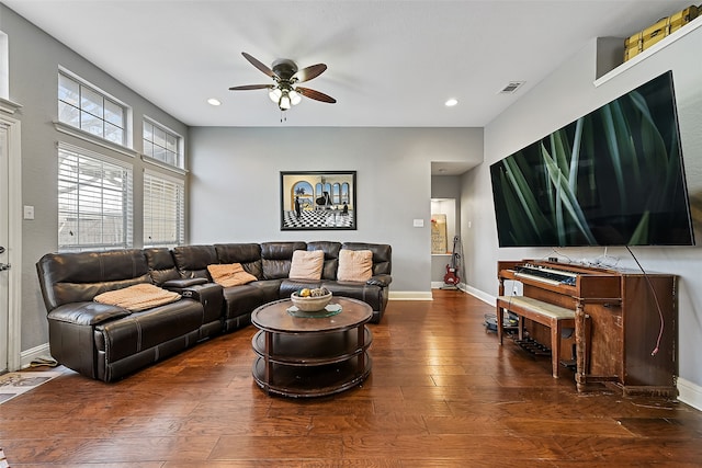 living area with dark wood-style flooring, recessed lighting, visible vents, and baseboards