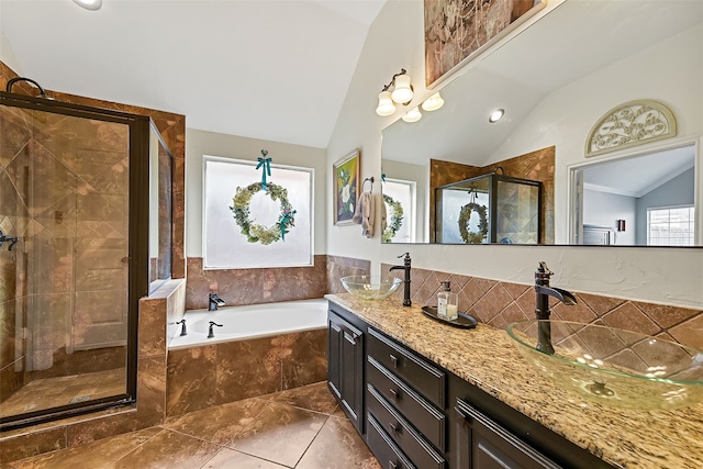 full bath featuring lofted ceiling, a shower stall, vanity, and a bath