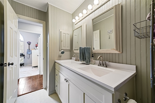 full bathroom featuring a sink and double vanity