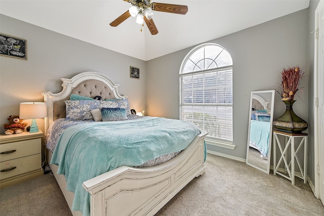 bedroom with baseboards, a ceiling fan, and light colored carpet