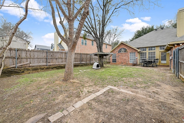 view of yard with a fenced backyard and a patio