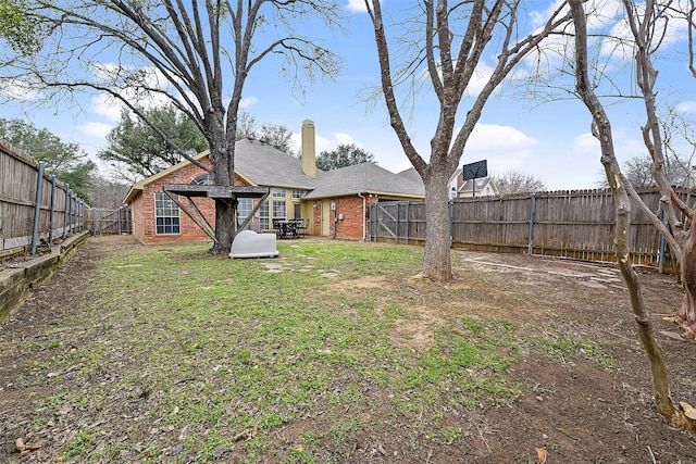 view of yard featuring a fenced backyard