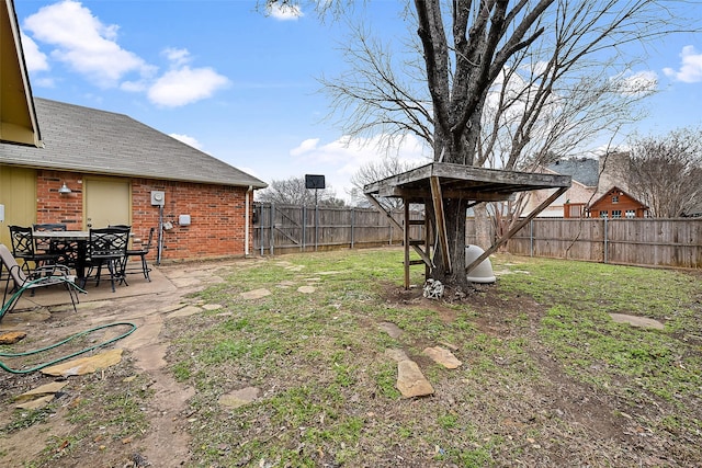 view of yard featuring a patio area and a fenced backyard